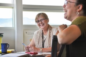 Margaret Macintyre Latta, project director, consults with educators from School District 23