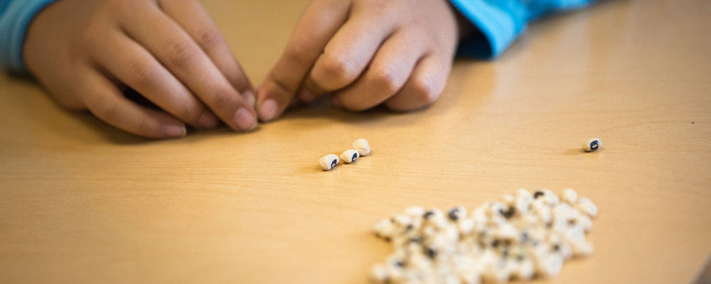 Girl counting beads